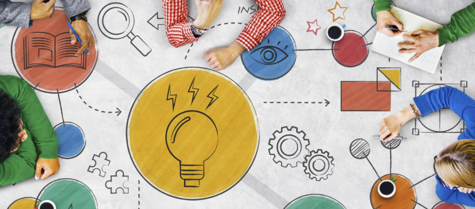 Decorative image of people working on a design project together, surrounded by various sketches